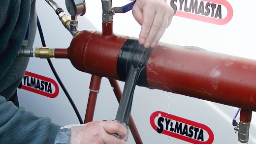 Live leak repair made to a stainless steel test pipe at Sylmasta HQ made using Wrap & Seal Pipe Burst Tape