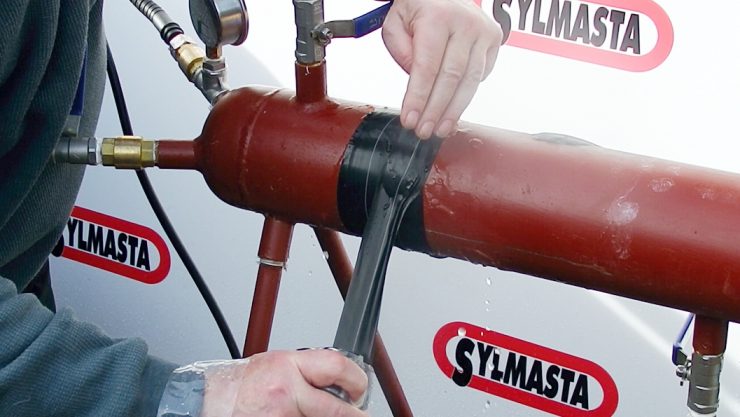 Live leak repair made to a stainless steel test pipe at Sylmasta HQ made using Wrap & Seal Pipe Burst Tape